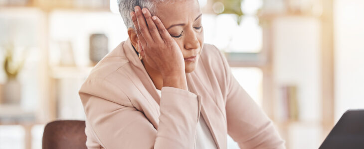 Stress, accountant or burnout woman on laptop for financial crisis, mental health or invest depression in office. Finance, tired or sad advisor for stock market, invest budget or mortgage planning