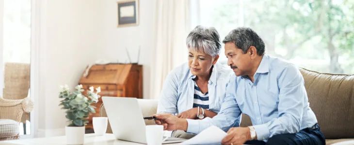 Shot of a senior couple using a laptop together at home