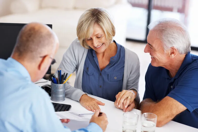 Couple signing guardianship with their attorney